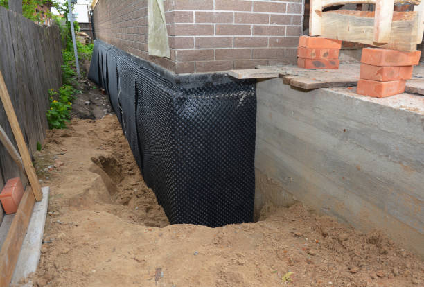 Happy homeowners after waterproofing job in Roan Mountain